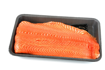 salmon fillet in black container tray
