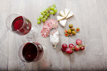 Still life with red wine and excellent food.