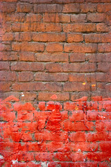 Painted brick wall half brown half red color. Good frame for text.