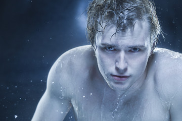 Strong man in drops of water 