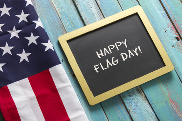 Flag Day chalk sign on blue wood background