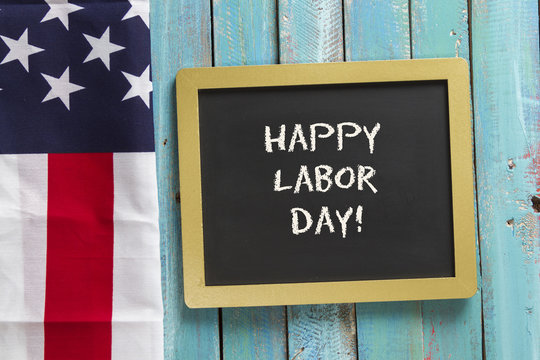 Labor Day chalk sign on blue wood background