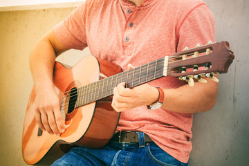 Trendy guy with guitar outdoor