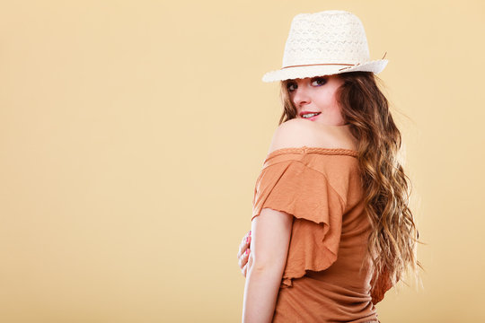 Lovely girl in summer clothes bright straw hat