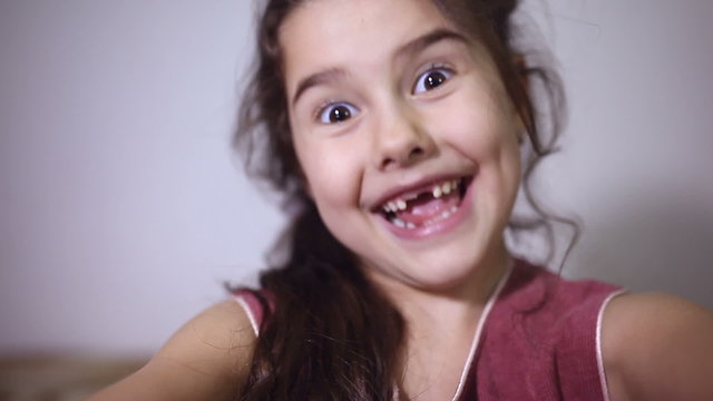 girl teen  toothless smile selfie makes 
