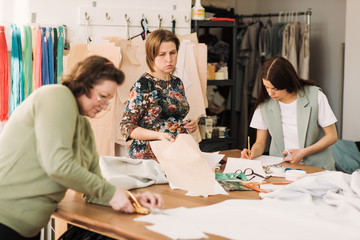 Fototapeta premium the work of fashion designer and tailors in the shop