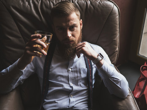 Attractive Man With Beard Is Resting At Home