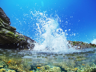 wave splash in the ocean against beach reef