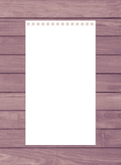 Blank white paper note on wood table.