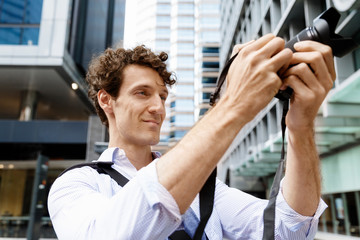 Male photographer taking picture