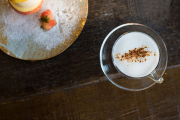 sweet vanilla ice cream in half of apple and little strawberry o