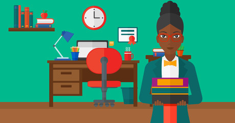 Woman holding pile of books.