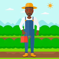 Farmer with watering can.