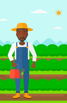 Farmer with watering can.