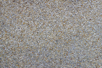 cement wall with tiny rock on surface texture, grunge background