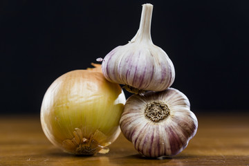 Onion Garlic and Ginger on Dark Background