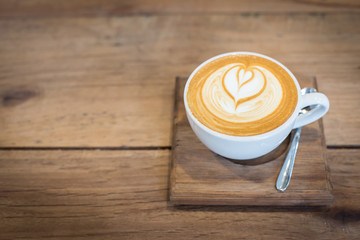 Hot art Latte Coffee on the table.