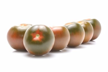 kumato tomatoes isolated on white background