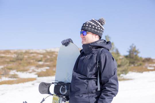 Peaceful man with snowboard