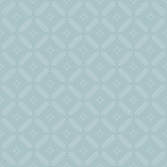 Geometric repeating light blue ornament with diagonal white dots. Seamless abstract modern pattern