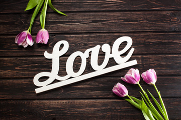 Inscription love and tulip
