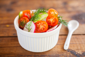 vegetable salad in a bowl on a table, selective focus