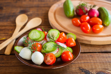 vegetable salad in a bowl on a table, selective focus