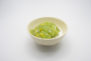 Tapioca pudding or Sakoo (Thai dessert) with coconut milk on white background