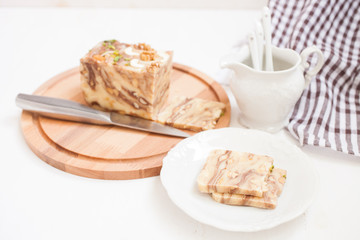creamy fondant with a shredded nut on a plate, selective focus