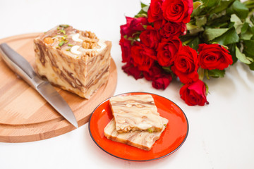 creamy fondant with a shredded nut on a plate, selective focus