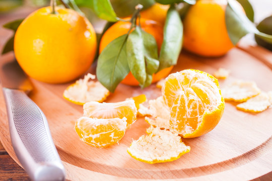 tangerines with leaves on a table, selective focus