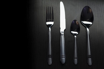 cutlery on a black table