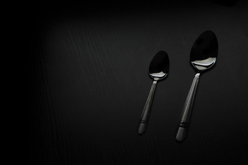 cutlery on a black table