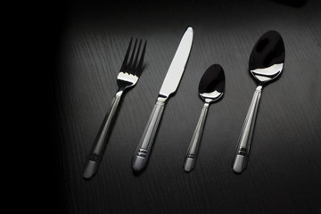 cutlery on a black table