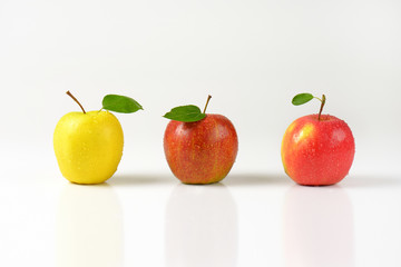 three freshly washed apples