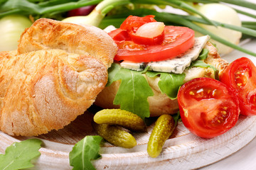 Vegetarian sandwich with blue cheese marinated peppers and onion