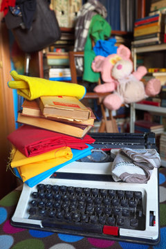 Vintage typewriter,colorful clothes and books