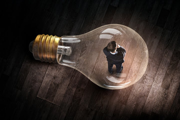 Man inside of electric bulb