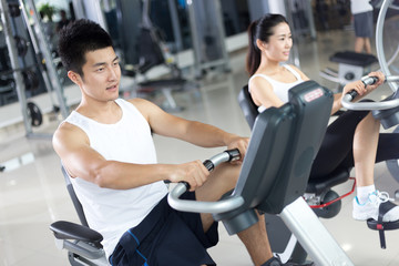 young people working out in modern gym