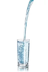 Zelfklevend Fotobehang a strong pouring water pouring into a glass isolated on white ba © sveta