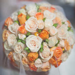bridal bouquet with orange and white roses