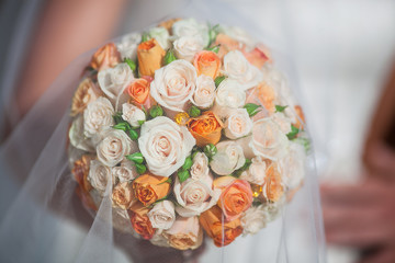bridal bouquet with orange and white roses