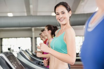 Fototapeta premium Fit woman running on treadmill