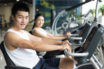 young people working out in modern gym