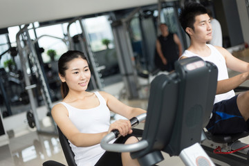Fototapeta premium young people working out in modern gym