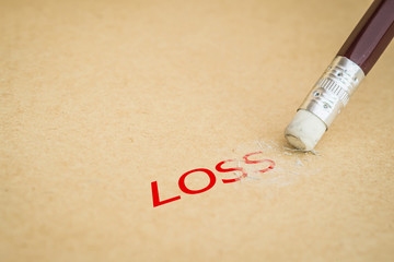 Closeup of pencil eraser on recycle paper, soft focus