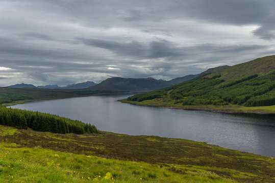 Loch Cluanie, Scotland lake and mountain landscape © irantzuarb