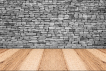 Empty top wooden table and natural stone wall background. For pr