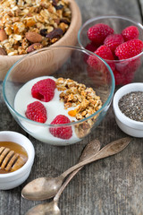 healthy snack - granola on wooden surface