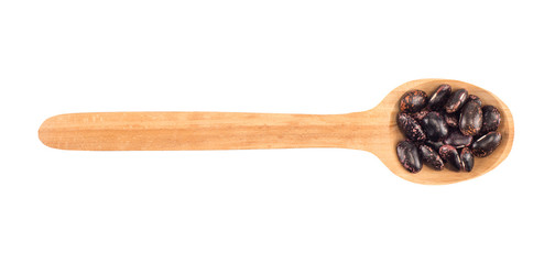 kidney beans on a wooden spoon isolated on white background